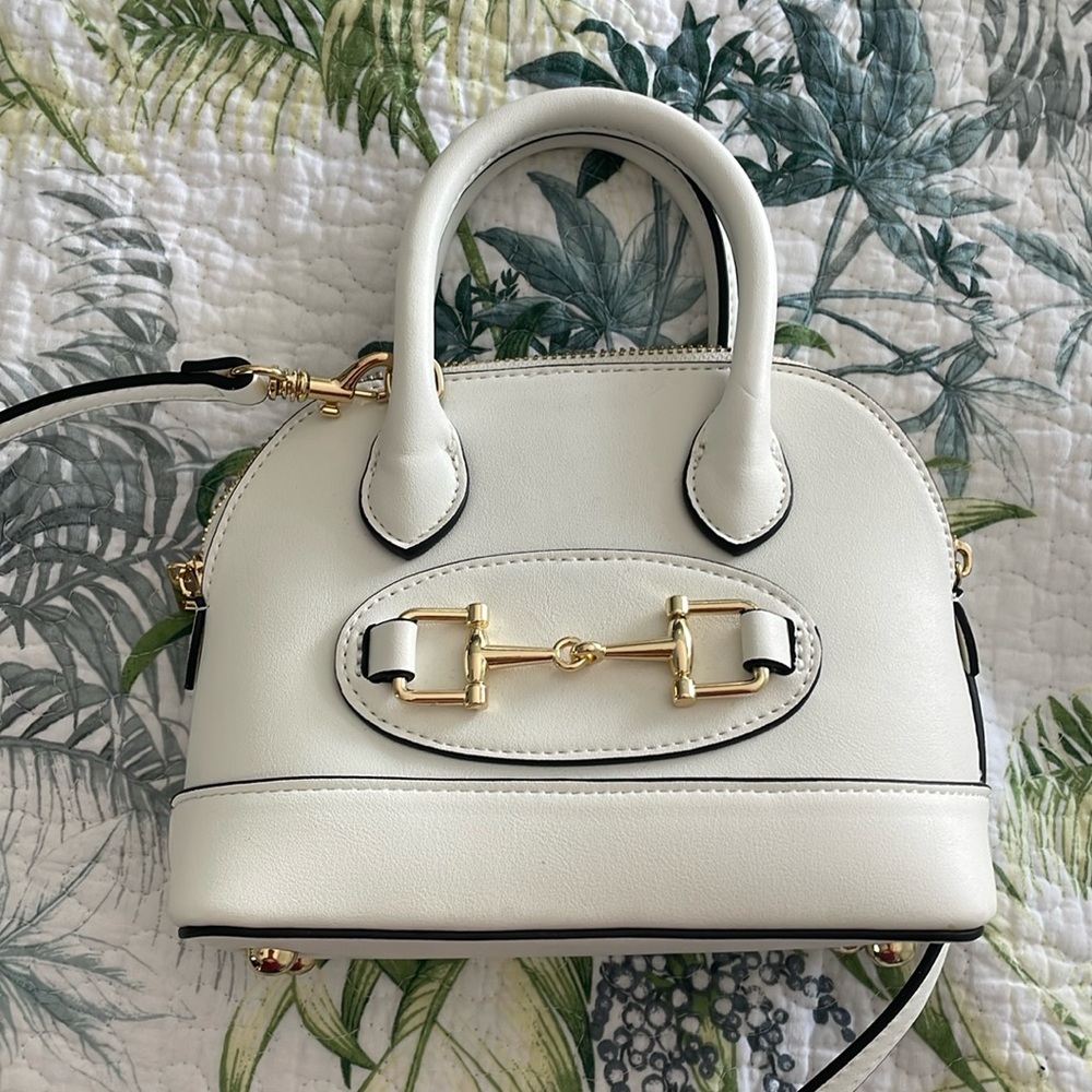 Never used! Adorable and classy mini purse…